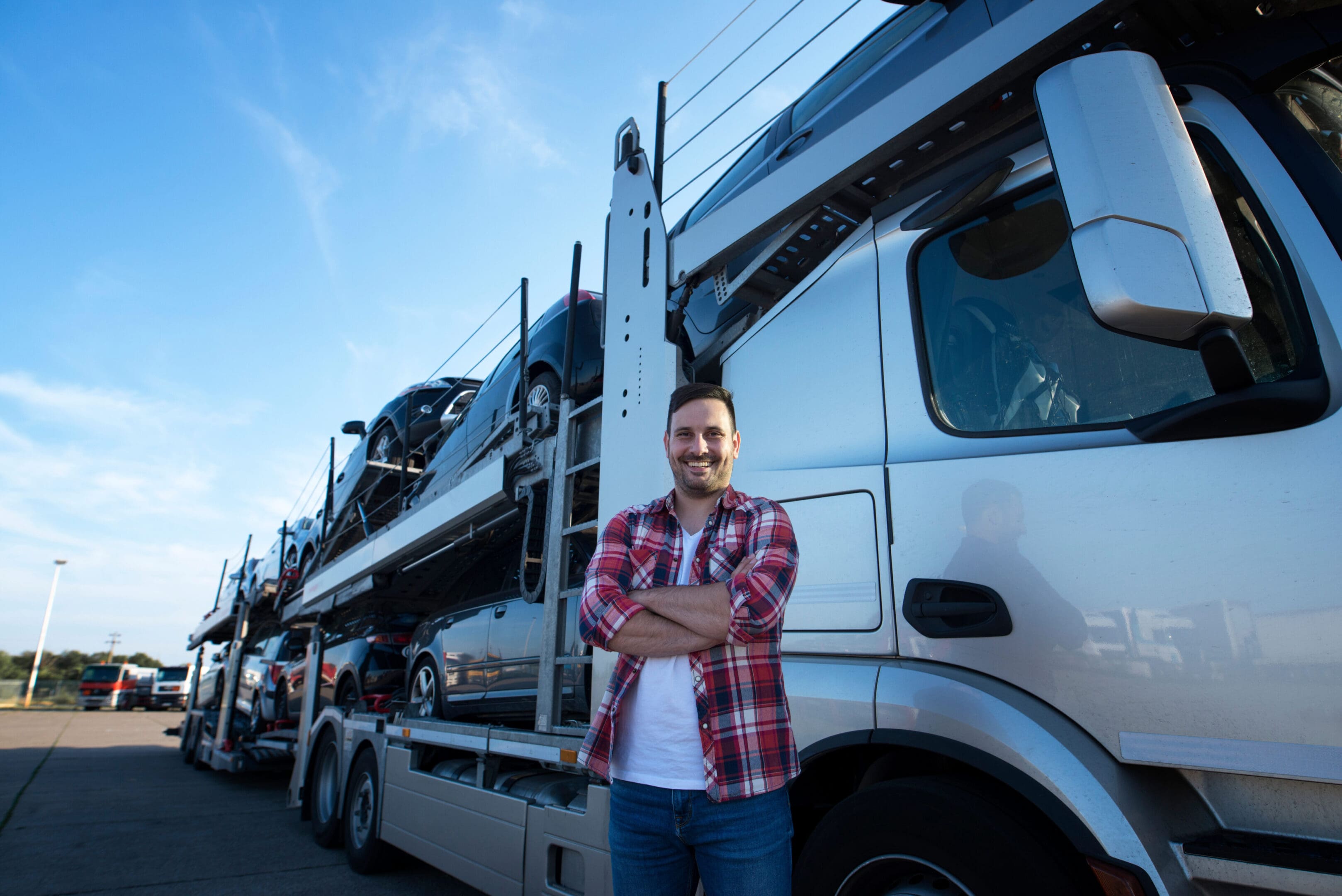 A man standing in front of a truck.